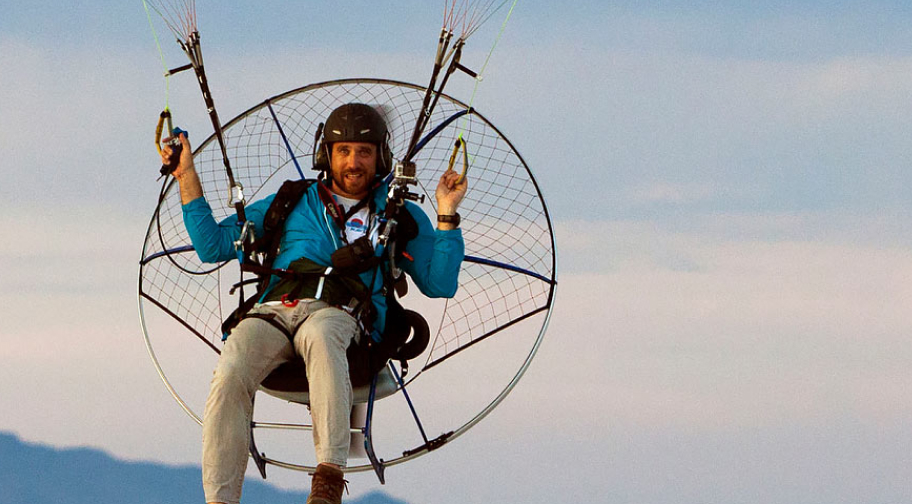 guy gliding with a paramotor